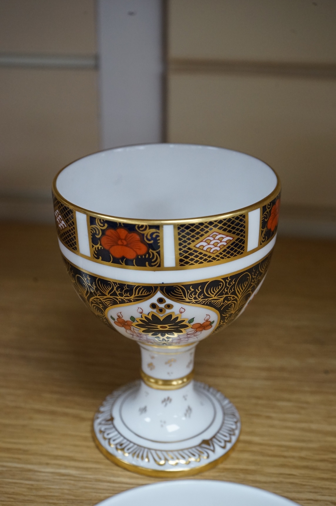 A group of six Royal Crown Derby stemmed cups (one cup and stem detached). 12.5cm high